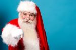 Happy Santa Claus Pointing At You Stock Photo