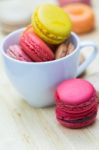 Macaron In Coffee Cup Stock Photo