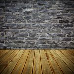Wooden Deck Floor And Brick Wall Stock Photo
