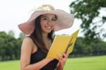 Beautiful Young Woman Reading Book At Park Stock Photo