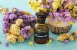 Essential Oil With Flower Stock Photo