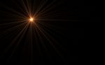 Abstract Lens Flare Dusty With Black Background.modern Abstract Beautiful Rays Light Streak Background.gold Sun Light Flare Effect Stock Photo