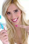 Woman Pointing At Toothbrush Stock Photo