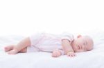 Newborn Baby Girl Sleeping In Bed Stock Photo