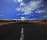 Passenger Air Plane Running On Airport Runway With Beautiful Blu Stock Photo