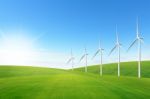 Wind Turbine On Green Grass Field Stock Photo