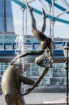 David Wayne Sculpture "girl With The Dolphin" Next To Tower Brid Stock Photo