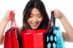 Shopaholic Girl Holding Shopping Bags Stock Photo