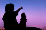 Silhouette Back View Of Mother And Child Hikers Enjoying The Vie Stock Photo
