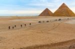 Pyramids Of Giza And Cyclists Stock Photo