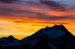 Vibrant Sunset Behind Mountian Stock Photo