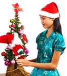 Girl Decorating Christmas Tree Stock Photo