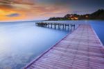 Wood Bridge Piers With Nobody And Smoothy Sea Water Against Beau Stock Photo