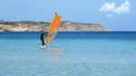 Windsurfer Enjoying A Summer Day In A Mediterranean See Stock Photo