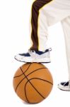A Small Kid With Leg Over The Ball Stock Photo