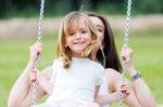 Mother And Daughter Having Fun Outdoors Stock Photo