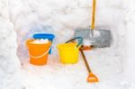 Hut With Walls Of Snow And Colorful Buckets Plus Snowplow Stock Photo