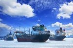 Oil And Industrial Tanker Transport Ship Floating On River Port Stock Photo