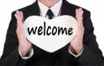 Businessman Holding Welcome Card Stock Photo