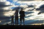 Parents And Children With Silhouettes Stock Photo