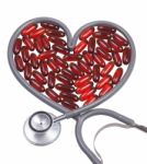 Heart Shape Stethoscope And Pills Stock Photo