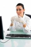 Smiling Female Doctor With Computer Stock Photo
