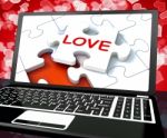 Love Puzzle On Laptop Shows Internet Dating Stock Photo