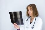 Dutch Female Doctor Looking At X-ray Photo Stock Photo