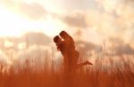 Romantic Couple In Grass Field,3d Rendering Stock Photo