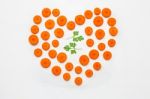 Chopped Carrot Slices Heart Shape And Parsley Leaves Stock Photo