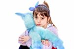 Little Girl Holding Blue Unicorn Toy Isolated On White Stock Photo