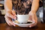 Hand Of Person Holding Coffee Cup Or Coffee Beans Stock Photo