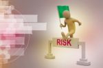 Person Jumping Over Word Risk With Flag Stock Photo