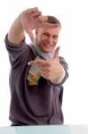 Young Man Showing Directing Hand Gesture Stock Photo