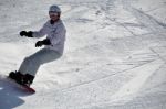 Female Snowboarder In Powder Snow Stock Photo
