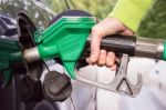 Female Hand Filling Car Tank With Gasoline Stock Photo