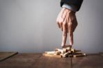 Hand Liken Business Person Stepping Up A Toy Wooden Block To Goa Stock Photo