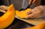 Cutting Japanese Melon Stock Photo
