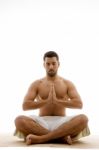 Man Practicing Yoga Stock Photo