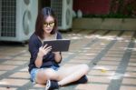 Portrait Of Thai Adult Student University Beautiful Girl Using Her Tablet Stock Photo