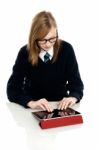 Bright Teen Student Using A Tablet Device Stock Photo