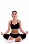 Fitness Woman Doing Meditation Stock Photo