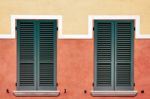Symmetrical Shutters On A Building In Desenzano Del Garda Stock Photo