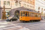 Historical Tram Operating Along City Streets Stock Photo