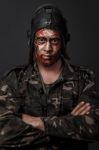 Creative And Funny Military Style Camouflage On Tankman Face Stock Photo