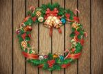 Christmas Wreath Over Wood Backdrop Stock Photo