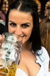 Girl Drinking Beer At Oktoberfest Stock Photo