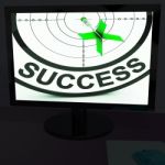 Success On Monitor Shows Progress Stock Photo