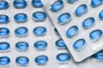 Blue Oil Pills Stock Photo
