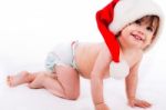 Baby Crawling With Santa Cap Stock Photo